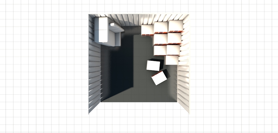 Top-down view of100 square foot storage unit containing sofa and some boxes and space.